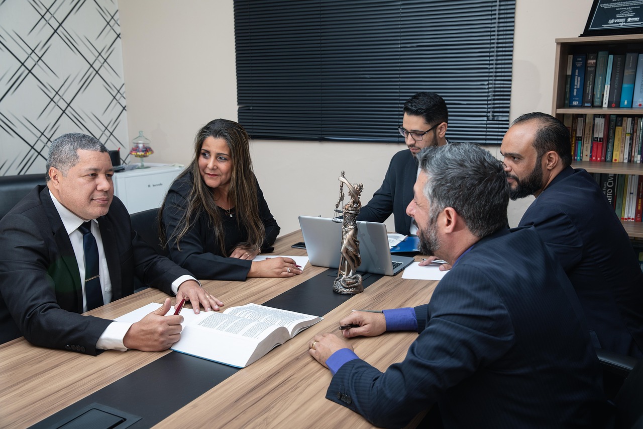 Professionals discussing documents at a conference table